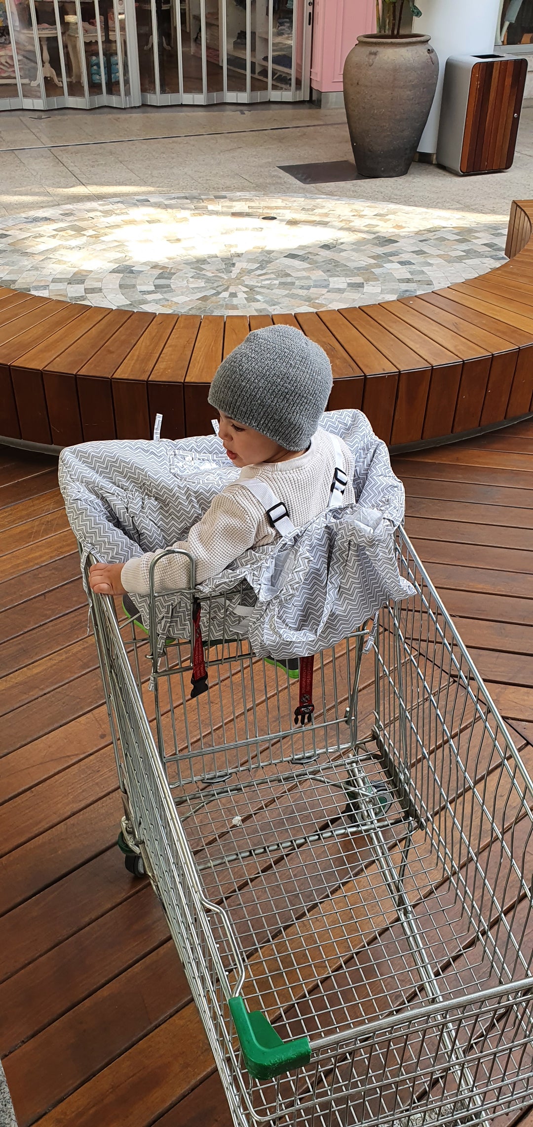 Shopping Cart Cover for Kids: Features a high back, extended sides, and a secure buckle, ensuring your child stays safe and snug in any shopping trolley.