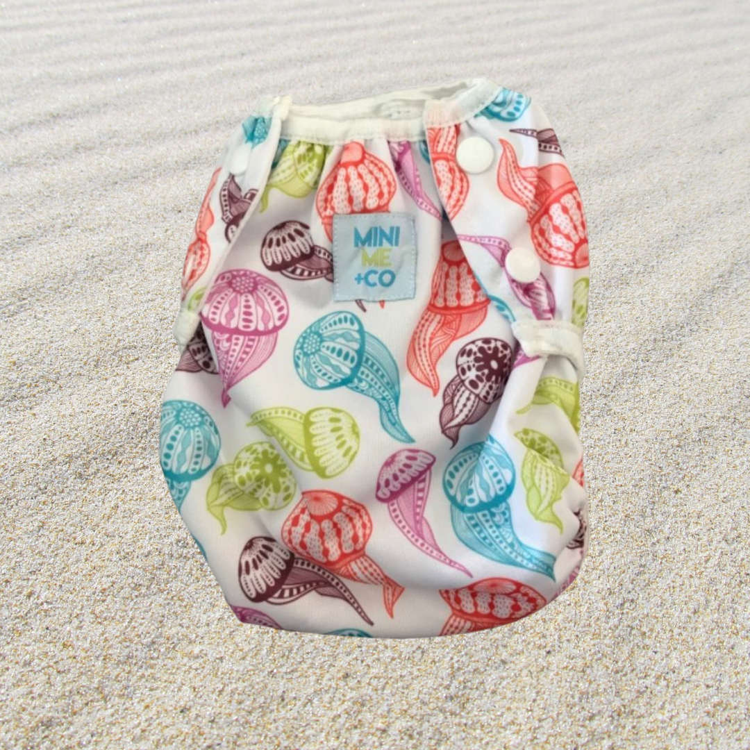 Jellyfish Print Swim Nappy: Bright and playful swim nappy adorned with charming jellyfish illustrations, providing comfort and leak protection for babies and toddlers.