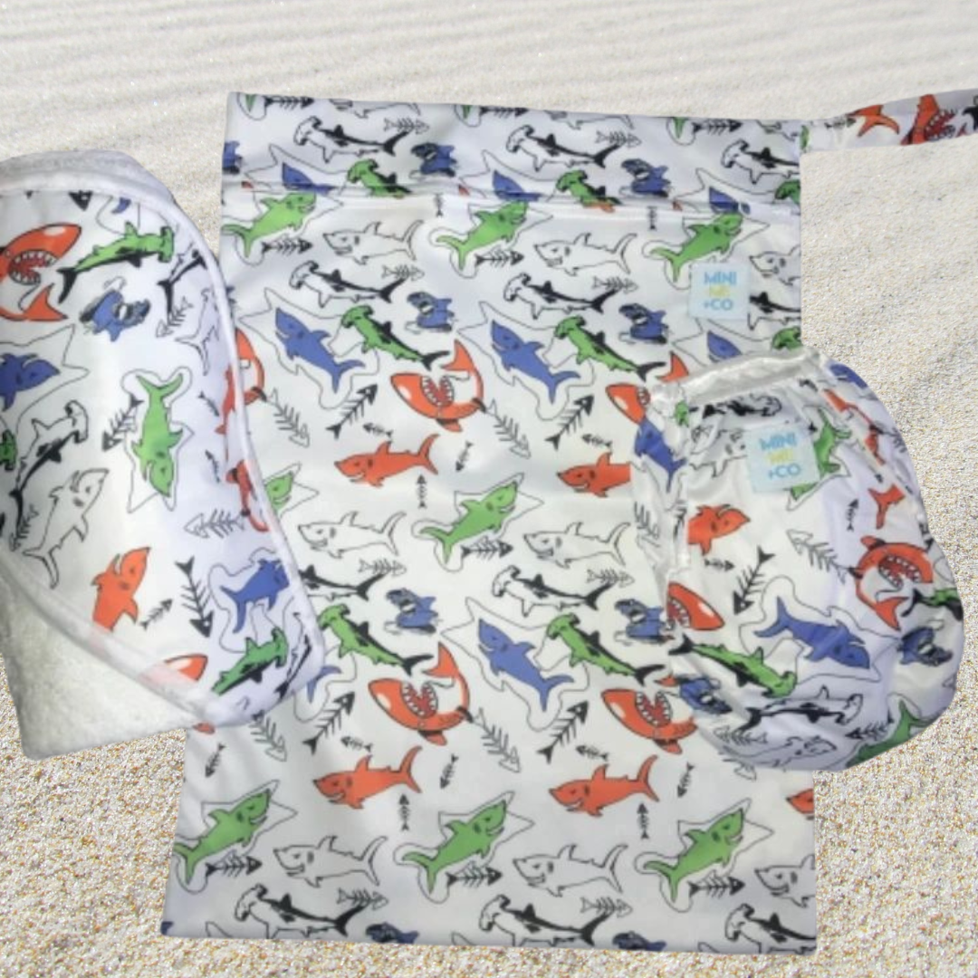 Dive into adventure with the Shark Swim Package, perfect for little ones who love the ocean! This exciting set includes a soft, absorbent swim towel adorned with a fun shark design, ideal for drying off after splashing around. Alongside the towel, the package features a matching waterproof wet bag that securely holds wet items, plus a comfortable reusable swim nappy designed for babies and toddlers. This playful and eco-friendly package makes beach and pool outings enjoyable while keeping your essentials or