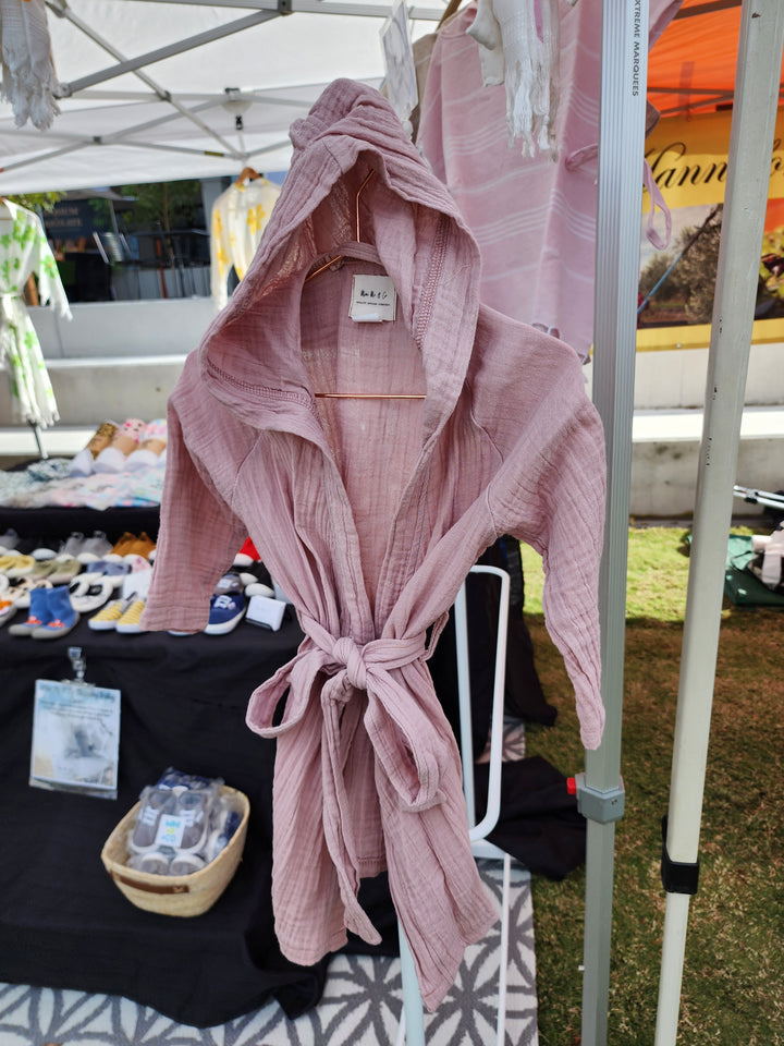 Cozy and lightweight powder pink kids robe, ideal for ages 1-6, with high absorbency and a soft, luxurious feel.