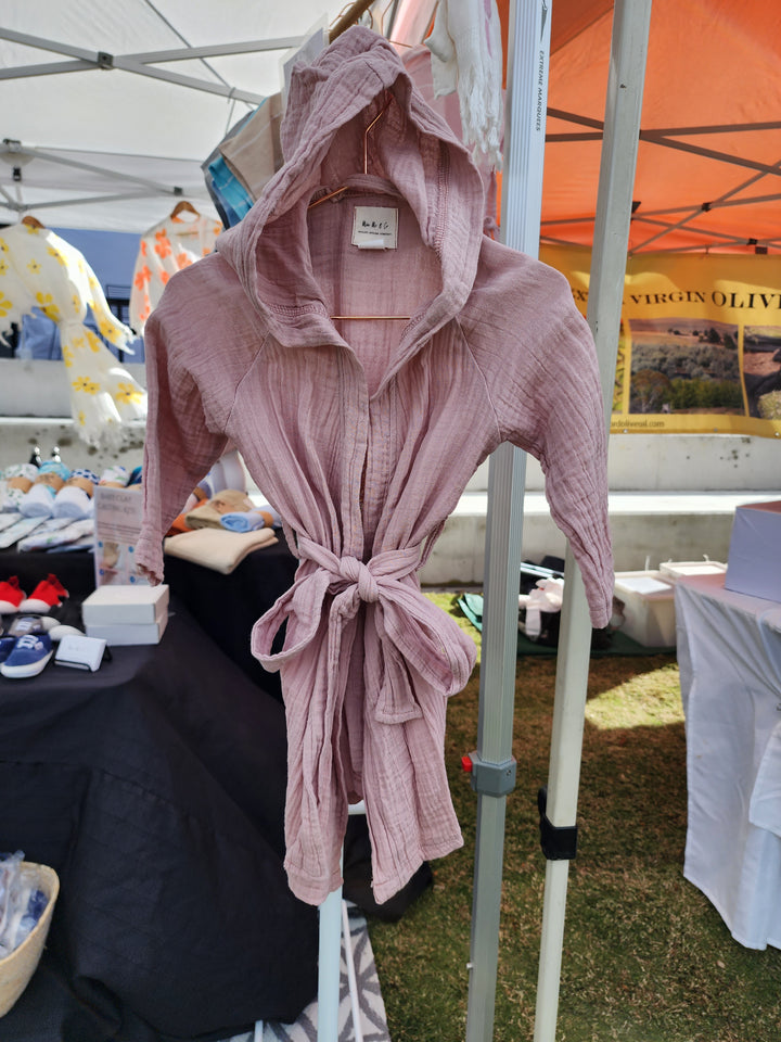 "Powder pink swim robe for kids, handmade with luxurious organic Turkish cotton for comfort and quick drying.