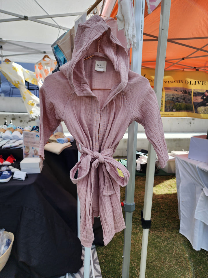 Soft and absorbent powder pink kids robe made from 100% organic Turkish cotton, perfect for after bath or swim time.