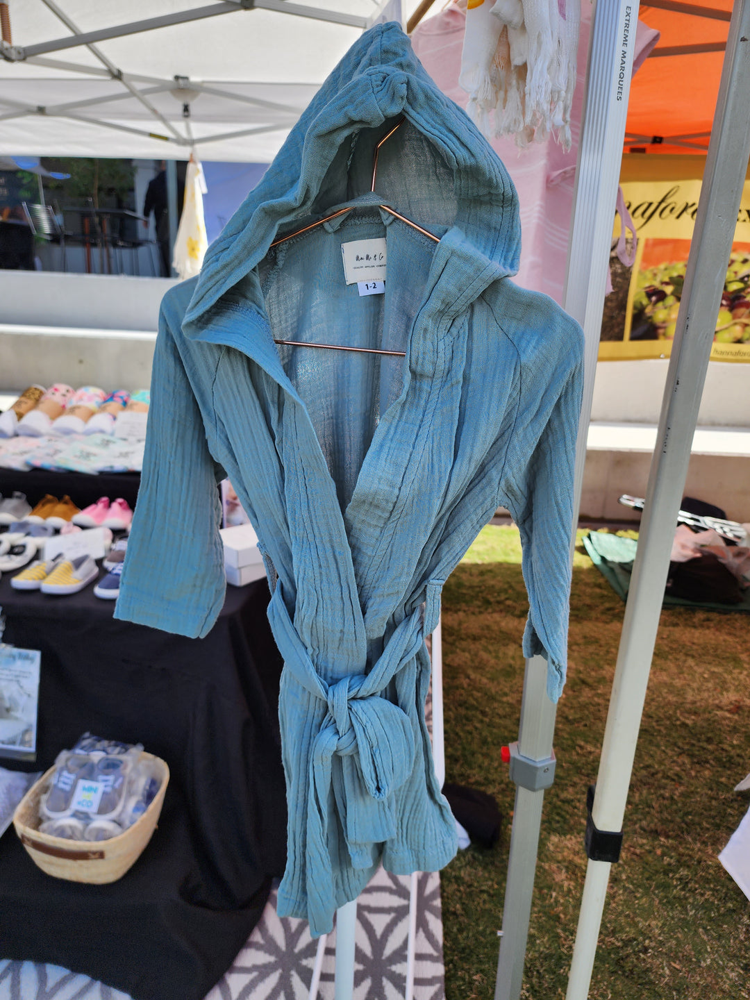 Cozy sage swim robe for kids, crafted from luxurious organic cotton for comfort and absorbency."