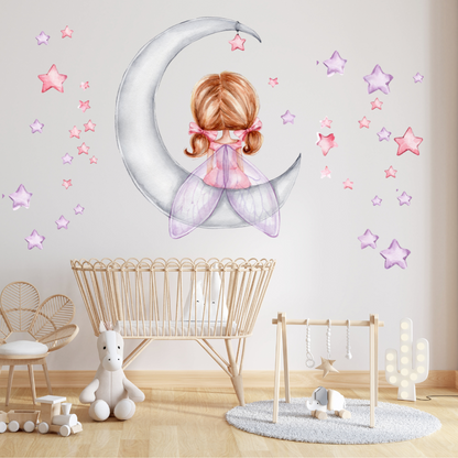 Mini Me & Co fairy on the moon and stars wall decals, featuring enchanting hand-drawn designs that add a whimsical touch to kids' rooms and nurseries. These repositionable, non-toxic fabric decals come with a matte finish, making them perfect for creating a dreamy, celestial atmosphere.