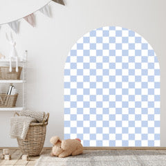 Checkered blue and white rug on a wooden floor with a shelf and basket in the background.