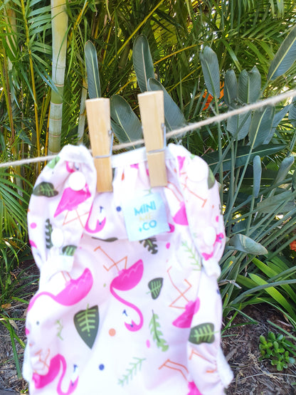 Large Flamingo Swim Nappy: Dive into fun with our large flamingo swim nappy! Perfect for the beach or pool, this swim nappy features a cheerful flamingo design that kids will love. Crafted from soft, eco-friendly materials, it offers a secure, leak-proof fit for toddlers weighing 10kg and up. Reusable and durable, it’s a smart, stylish choice for environmentally conscious parents.

