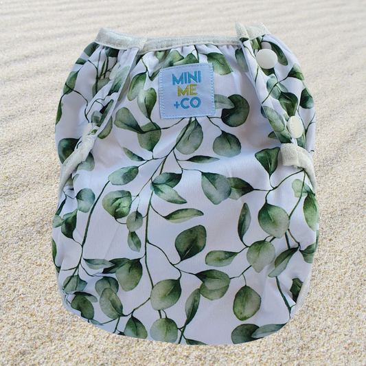 Large Eucalyptus Swim Nappy: Keep your little one comfortable and stylish with our large eucalyptus swim nappy. Designed for maximum absorbency and leak-proof protection, this swim nappy features a beautiful eucalyptus print that’s perfect for beach days or swimming lessons. Made from soft, eco-friendly materials, it offers a snug fit while allowing freedom of movement. Ideal for toddlers weighing 13.5kg and up, this reusable swim nappy is both practical and environmentally friendly.

