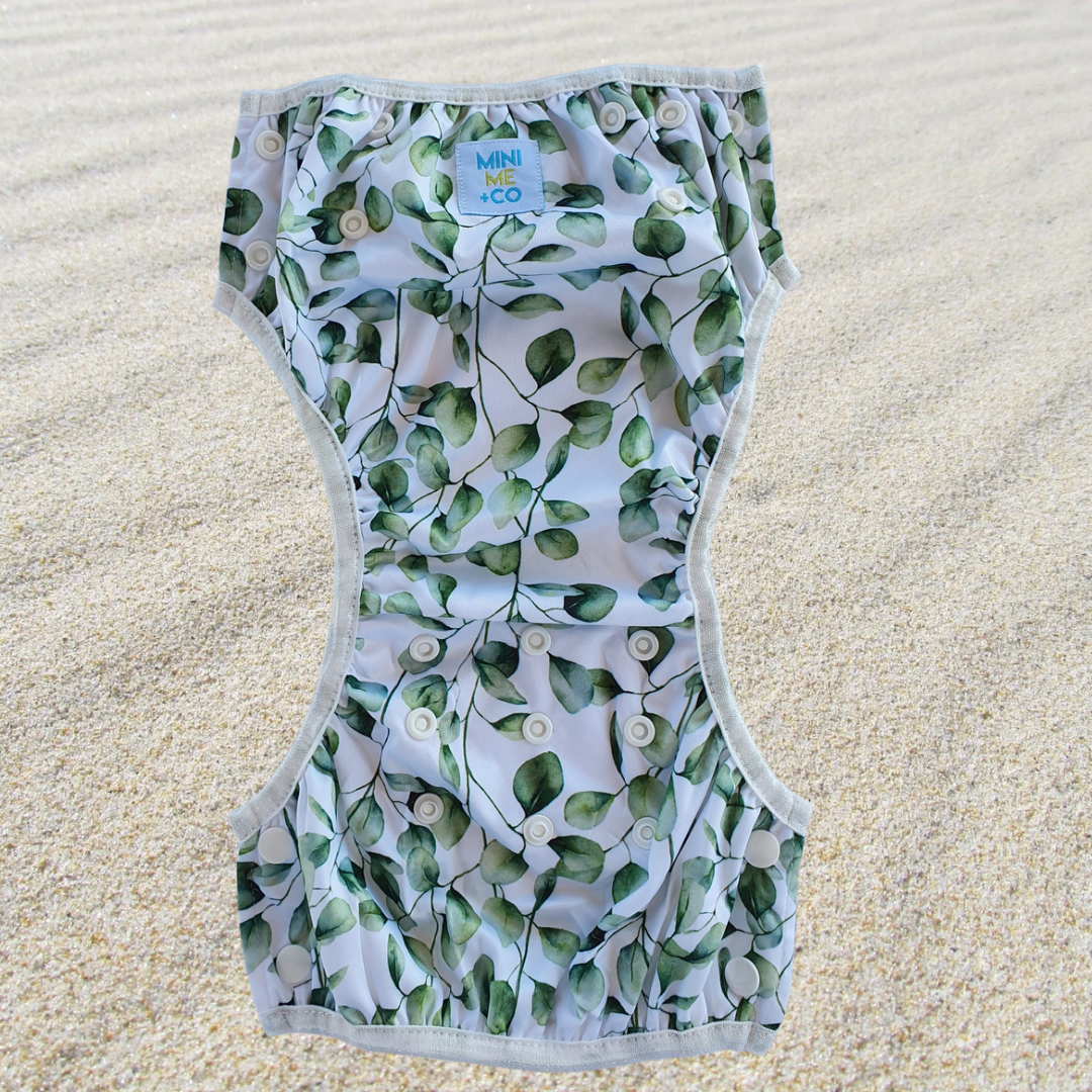 Eucalyptus Print Swim Nappy: Stylish swim nappy adorned with beautiful eucalyptus leaves, designed for comfort and leak protection for babies and toddlers.