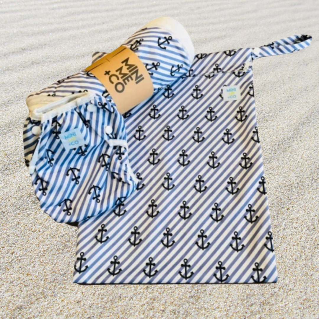 Ultimate Swim Package featuring reusable swim nappy, matching wet bag, and soft towel in vibrant designs, perfect for beach and pool days with your baby