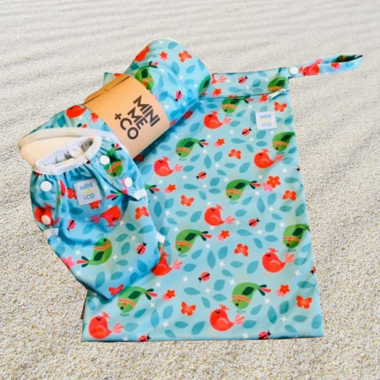 The Mini Me & Co Bird Ultimate Swim Package includes a stylish and functional design perfect for beach days and swimming lessons. This package features a reusable swim nappy, a matching wet bag, and a soft hooded towel, all adorned with a vibrant bird motif. Made from eco-friendly materials, the swim nappy is adjustable and free from harmful chemicals, ensuring comfort and safety for your little one. The wet bag provides waterproof storage for wet items, while the hooded towel offers warmth and comfort afte