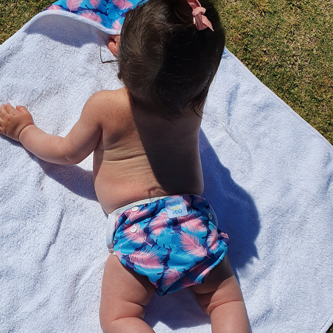 Feather-themed baby hooded towel by Mini Me & Co, designed for comfort and warmth after bath time.