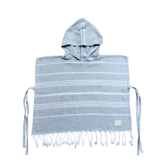 Stylish kids poncho towel, perfect for playtime at the beach or pool, ensuring kids look fashionable while staying dry.