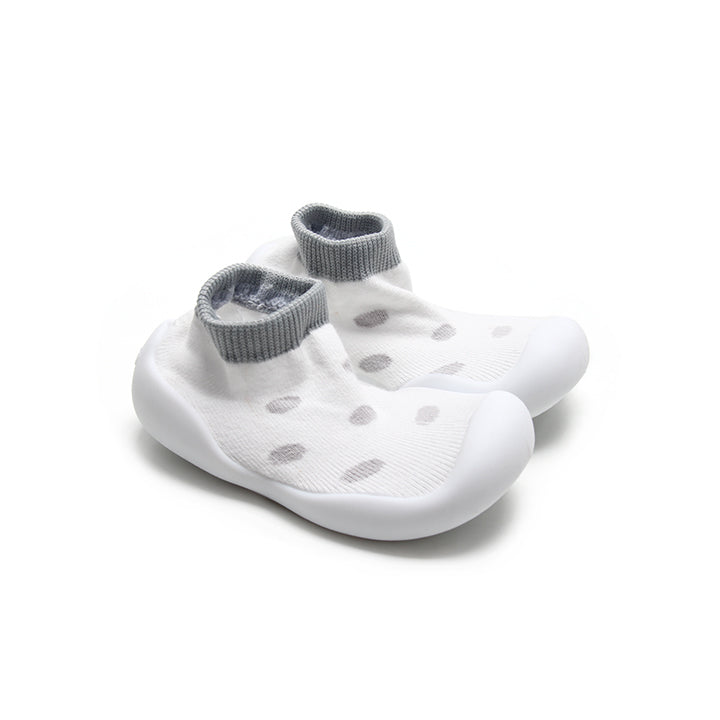 Trendy white and grey leopard sock shoes with a non-slip rubber sole, providing stability for little feet.