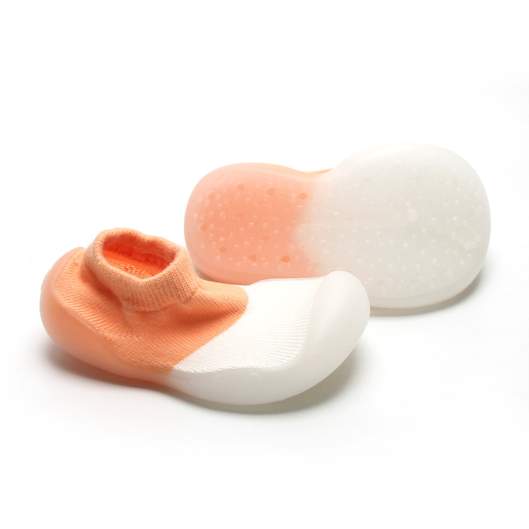 Trendy peach and white sock shoes with flexible sole, perfect for natural foot development.