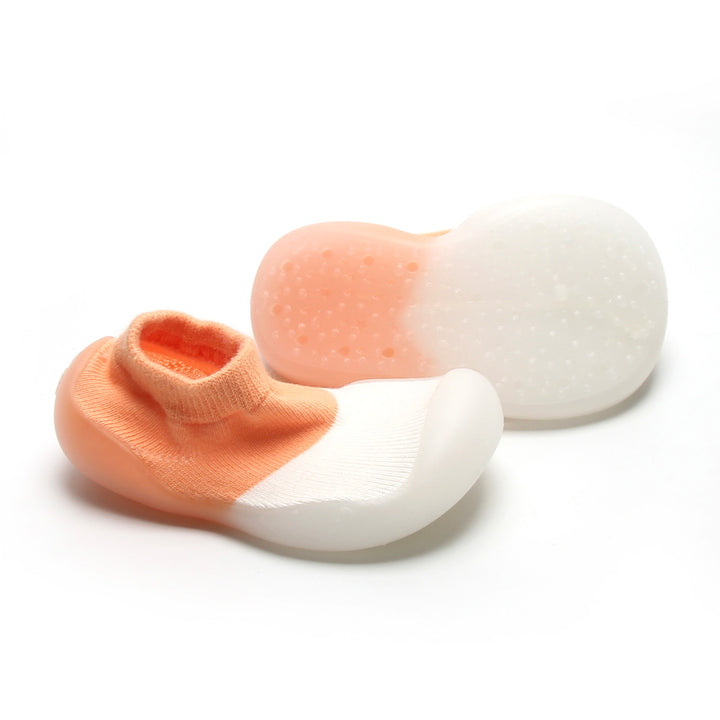 Trendy peach and white sock shoes with flexible sole, perfect for natural foot development.