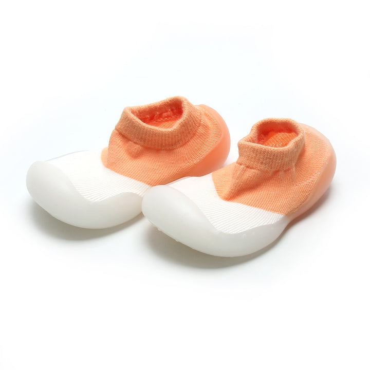 Comfortable peach and white sock shoes for kids, ideal for pre walkers with non-slip rubber sole