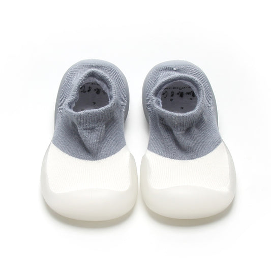 Blue and white two-toned sock shoes for kids with breathable cotton upper and flexible rubber sole.