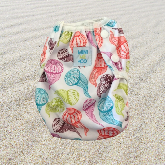 Jellyfish Print Swim Nappy: Bright and playful swim nappy adorned with charming jellyfish illustrations, providing comfort and leak protection for babies and toddlers.