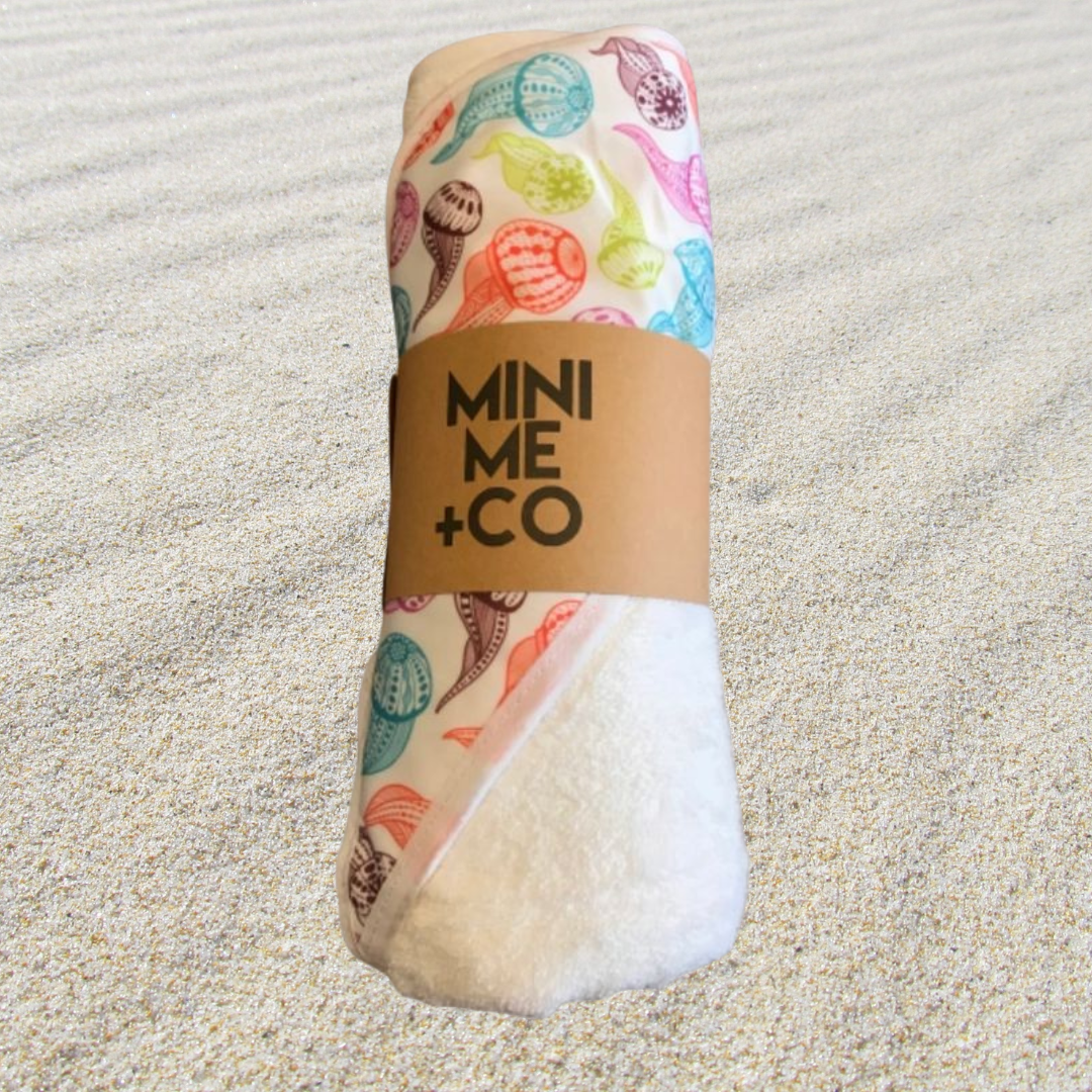 Luxurious baby hooded towel made from organic cotton, perfect for the beach, pool and bath.