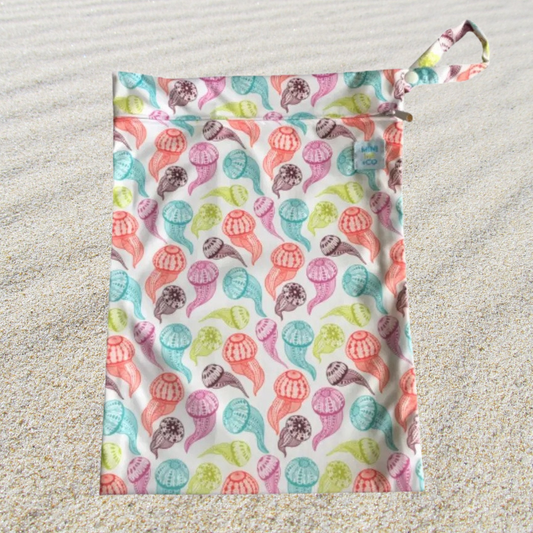 Jellyfish Waterproof Wet Bag: Dive into style with our jellyfish waterproof wet bag! This charming bag is ideal for storing wet items like swimwear, towels, or cloth diapers. Crafted from durable, eco-friendly materials, it features a whimsical jellyfish design that adds a touch of fun to your essentials.