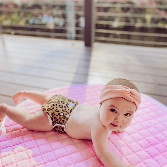 Mini Me & Co Leopard Print Reusable Swim Nappy: An adjustable swim nappy featuring a trendy leopard print design, perfect for stylish adventures at the pool or beach.