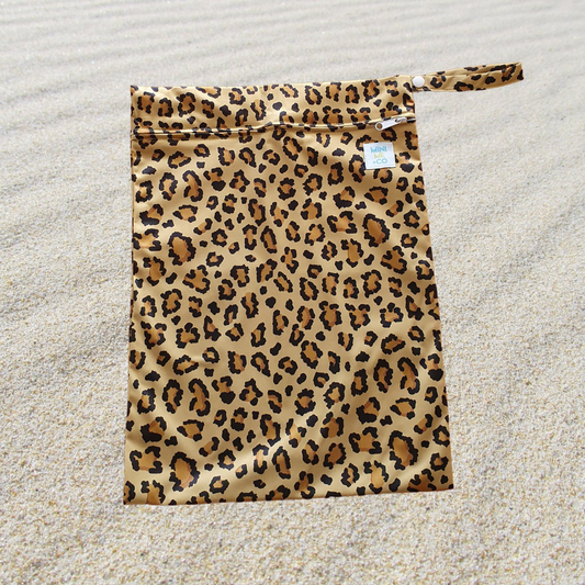 Leopard Print Waterproof Wet Bag: Unleash your wild side with our leopard print waterproof wet bag! Perfect for keeping wet clothes, swim gear, or cloth diapers organized, this stylish bag is made from durable, eco-friendly materials. Its eye-catching leopard design adds a trendy flair to your essentials, while the lightweight and reusable construction makes it an ideal choice for busy parents on the go.