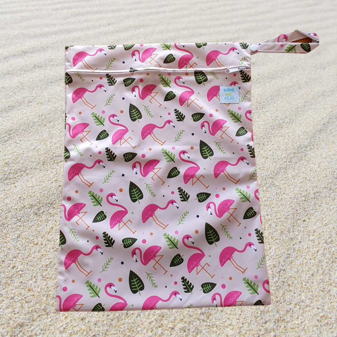 Flamingo Waterproof Wet Bag: Brighten up your day with our playful flamingo waterproof wet bag! Designed to keep wet items contained, this bag is perfect for swim gear, messy clothes, or cloth diapers. Made from durable, eco-friendly materials, it features a fun flamingo print that adds a splash of color to your essentials. Lightweight and reusable, it's a practical solution for parents on the go.