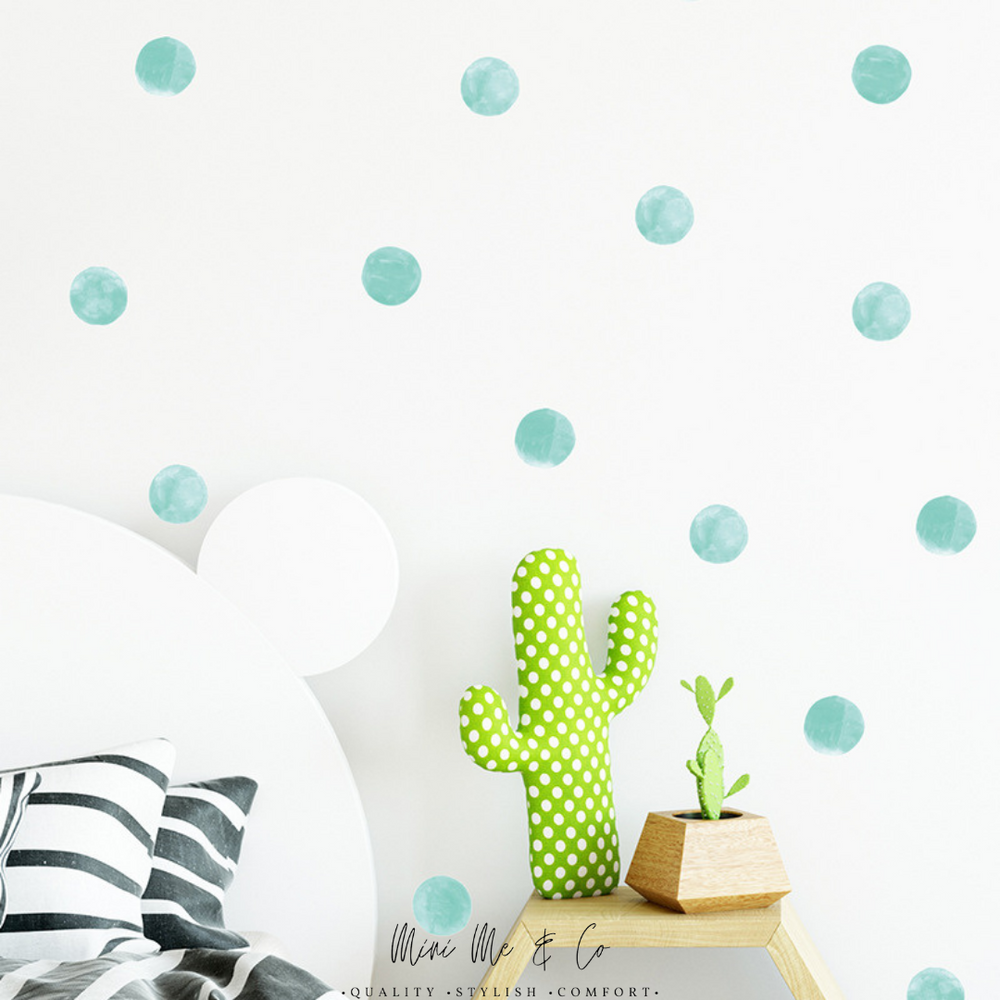 Aqua Polka Dot Decals by Mini Me & Co, featuring cheerful aqua dots designed to brighten up any nursery or playroom. These removable wall stickers are non-toxic and easy to reposition, making decorating a breeze