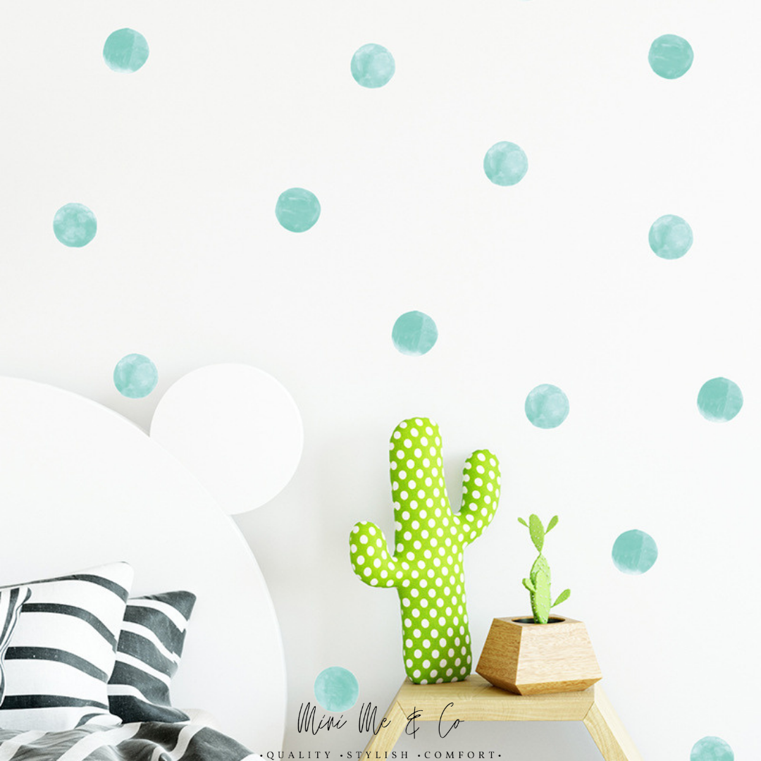 Aqua Polka Dot Decals by Mini Me & Co, featuring cheerful aqua dots designed to brighten up any nursery or playroom. These removable wall stickers are non-toxic and easy to reposition, making decorating a breeze