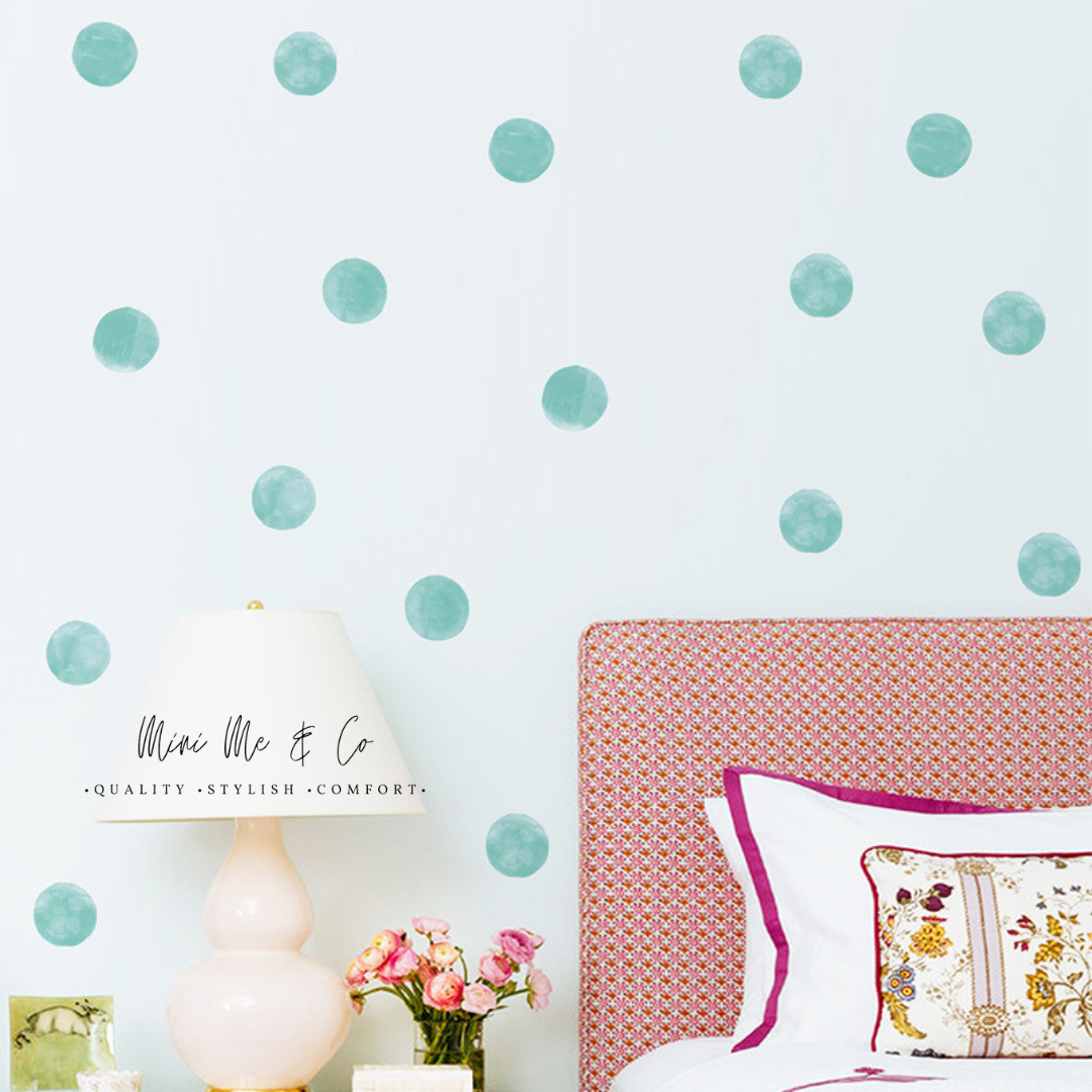 Mini Me & Co Aqua Polka Dot Decals in a soothing aqua shade, perfect for adding a playful touch to nurseries and children's rooms. Easy to apply and remove, these removable wall stickers create a fun and vibrant atmosphere for your little one.