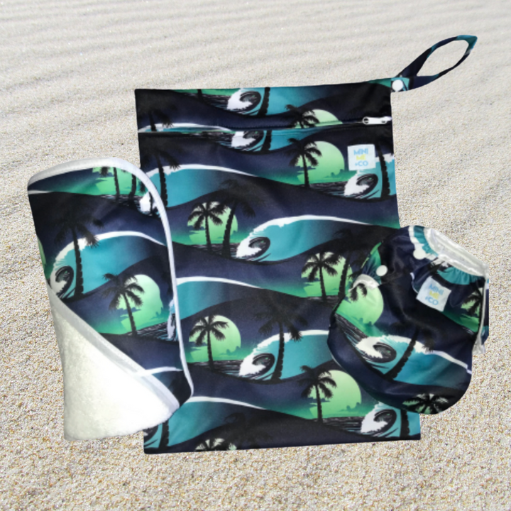 The Palm Tree Swim Package is a delightful collection of swim essentials designed for families who love fun in the sun. Featuring a colorful swim towel with an eye-catching palm tree print, this package is perfect for drying off after a splash in the water. Alongside the towel, you’ll find a matching waterproof wet bag to keep wet items secure, as well as a comfortable reusable swim nappy that fits snugly for little ones. This stylish and eco-friendly package ensures your beach and pool days are both enjoya