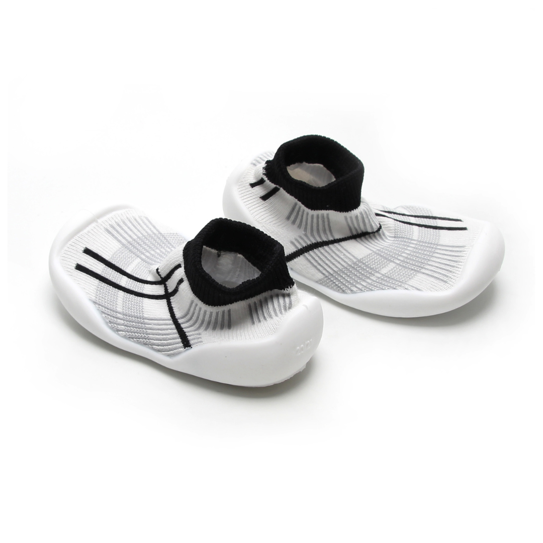 Grey and white tartan sock shoes for kids, featuring a seamless design and secure fit.