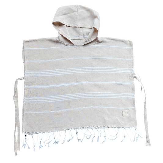 Luxurious kids poncho towel made from 100% organic Turkish cotton, showcasing soft texture and stylish design.