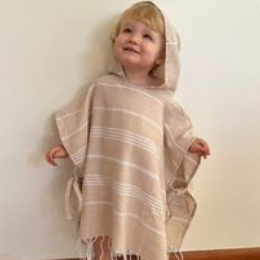 Kids poncho towel with convenient side ties for adjustable fit, designed for ages 1-4 and 5-8 years.