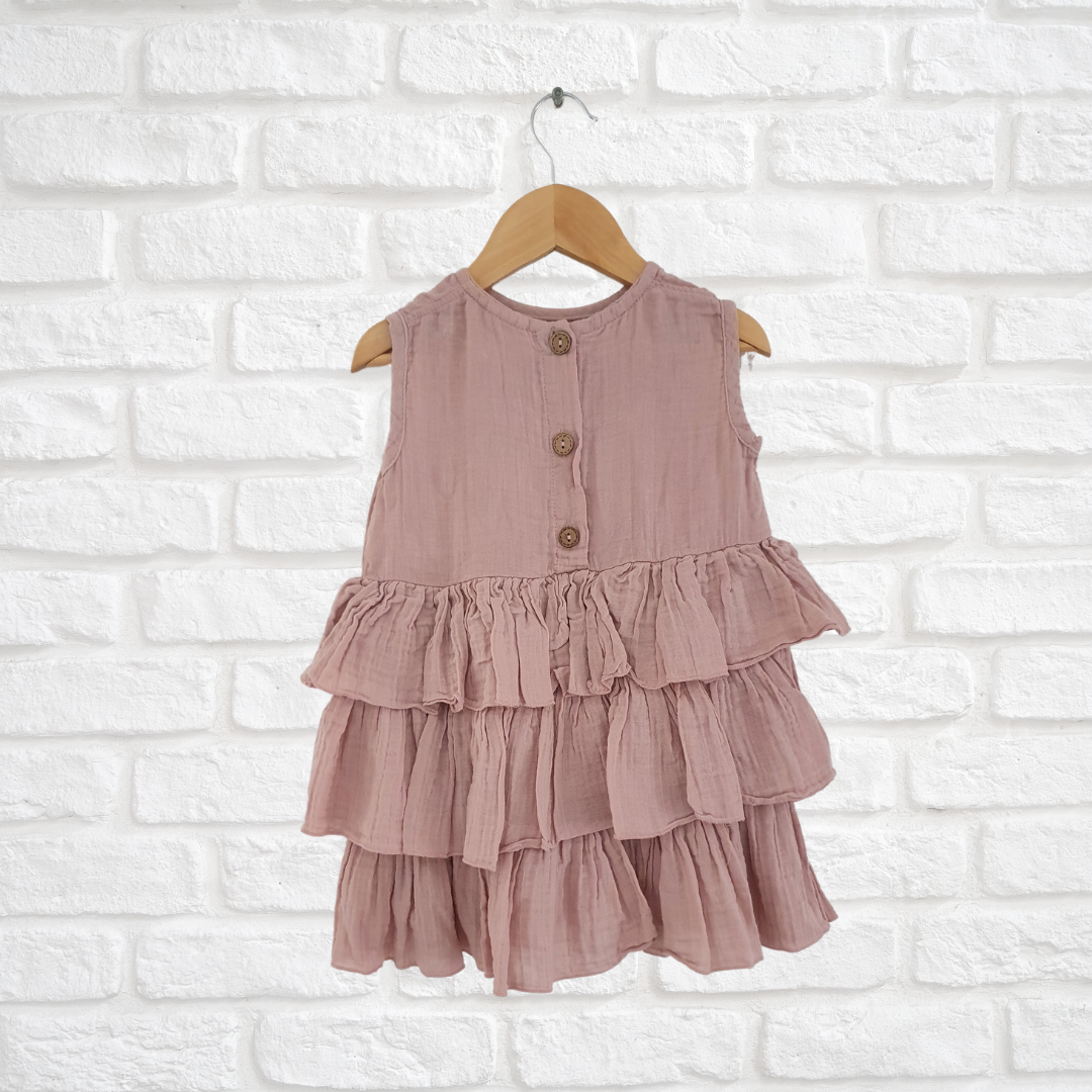 Handmade organic cotton dress with button back and playful ruffled detail for kids
