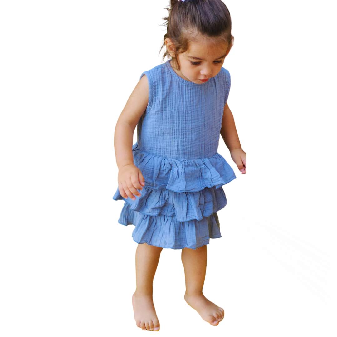 Breathable and soft organic muslin cotton dress with easy button closure and ruffled hem





