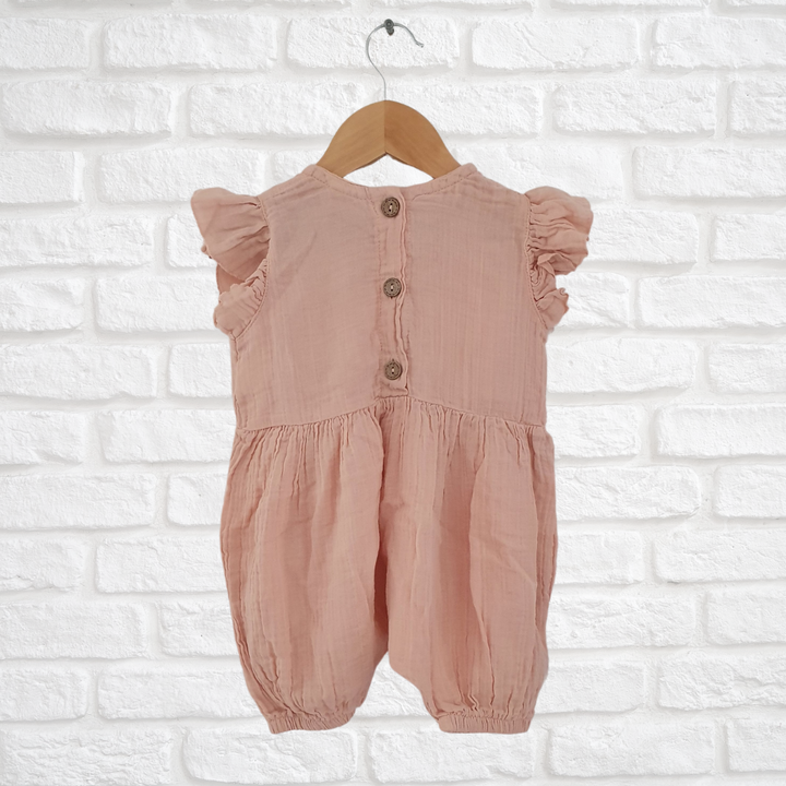 Cute organic muslin cotton overalls with adjustable buttons and ruffle accents
