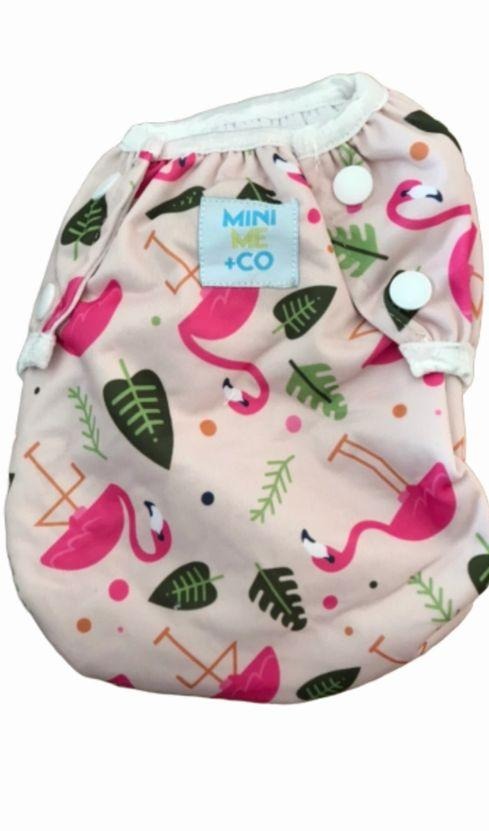 Stylish Flamingo Swim Nappy: Mini Me & Co swim nappy with a trendy flamingo design, providing a snug fit and peace of mind for parents.