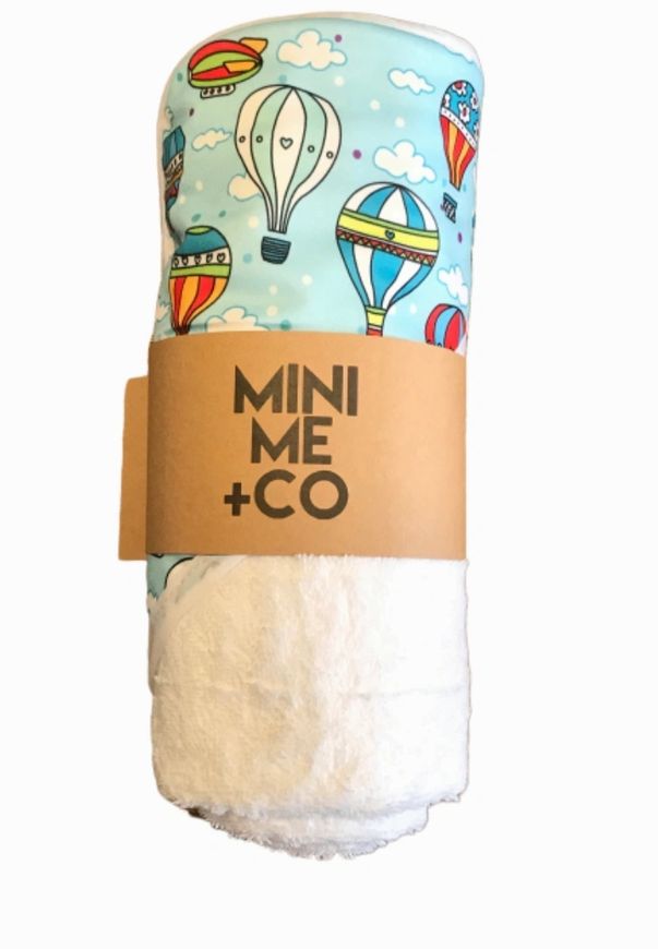 Hot air balloon-themed baby hooded towel by Mini Me & Co, perfect for keeping little ones cozy after bath time